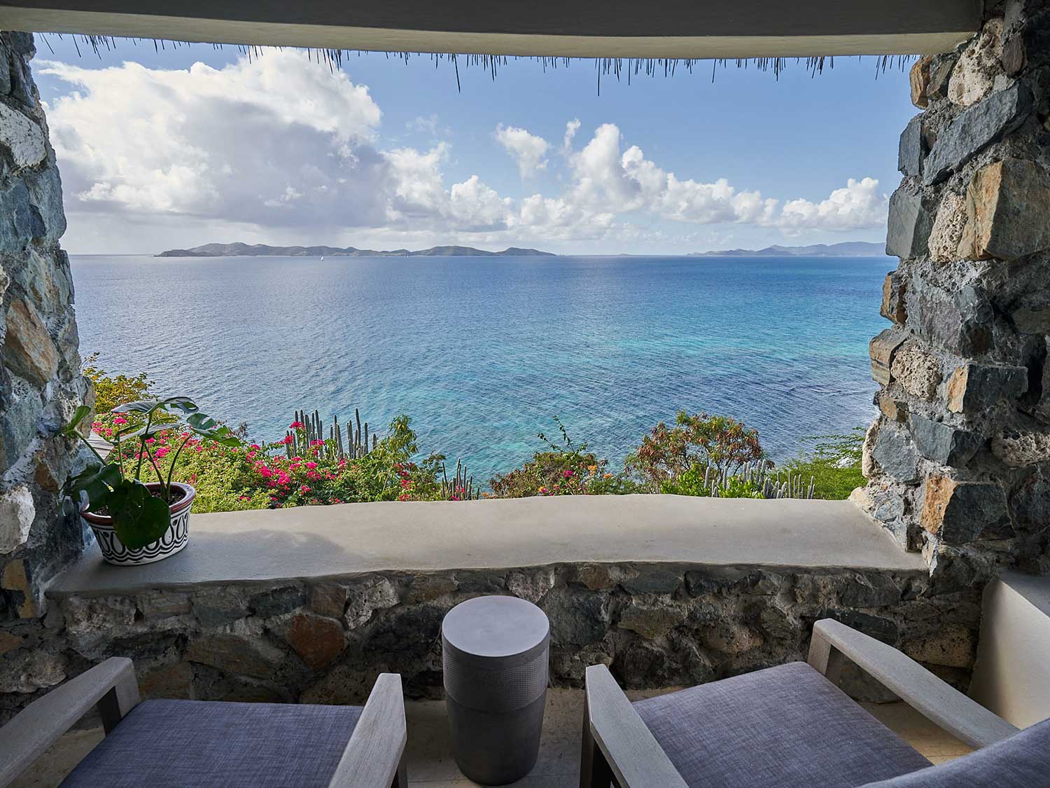 A resort window view overlooking the ocean of the British Virgin Islands.