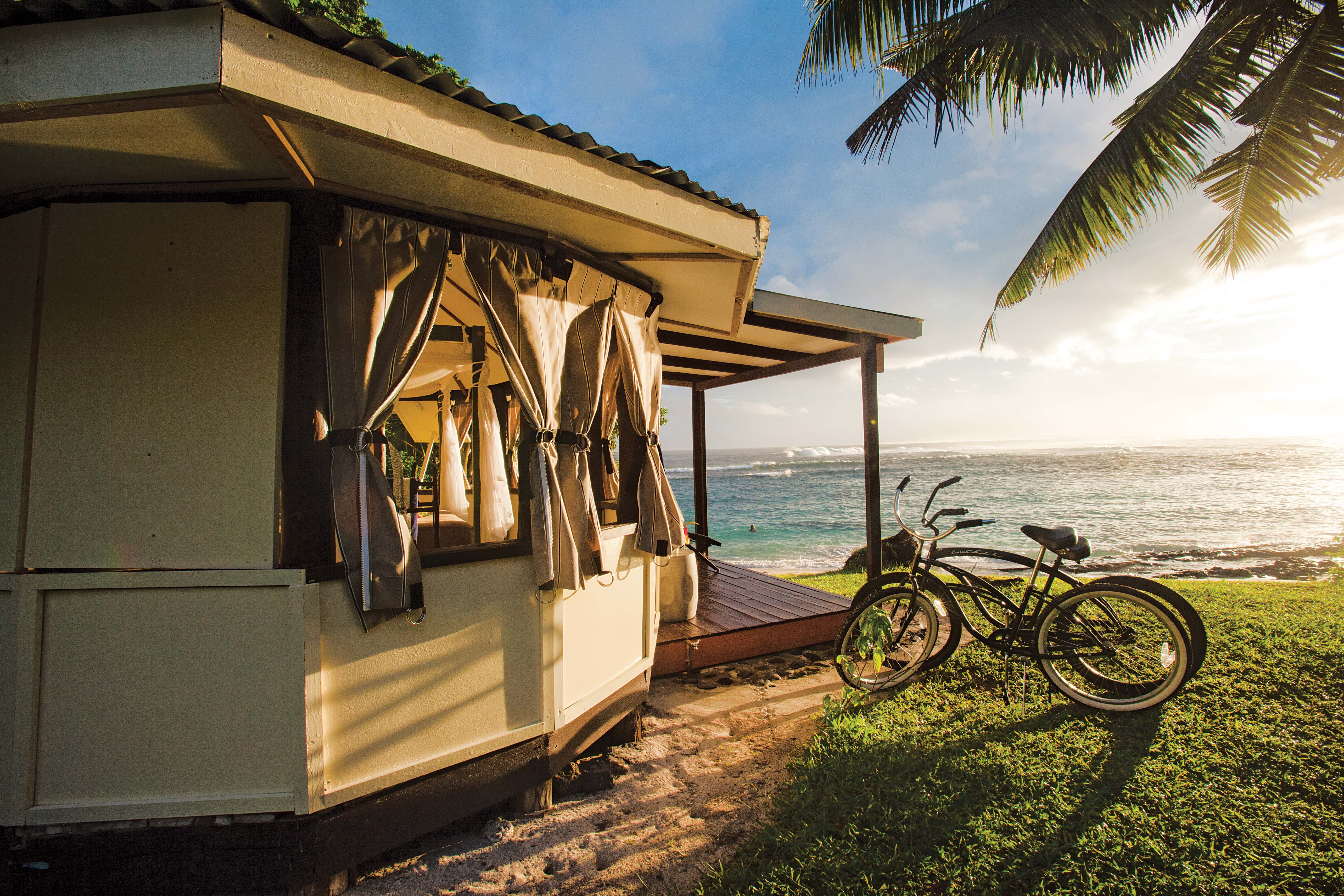 The Aganoa Lodge Samoa features open-air *fales.*