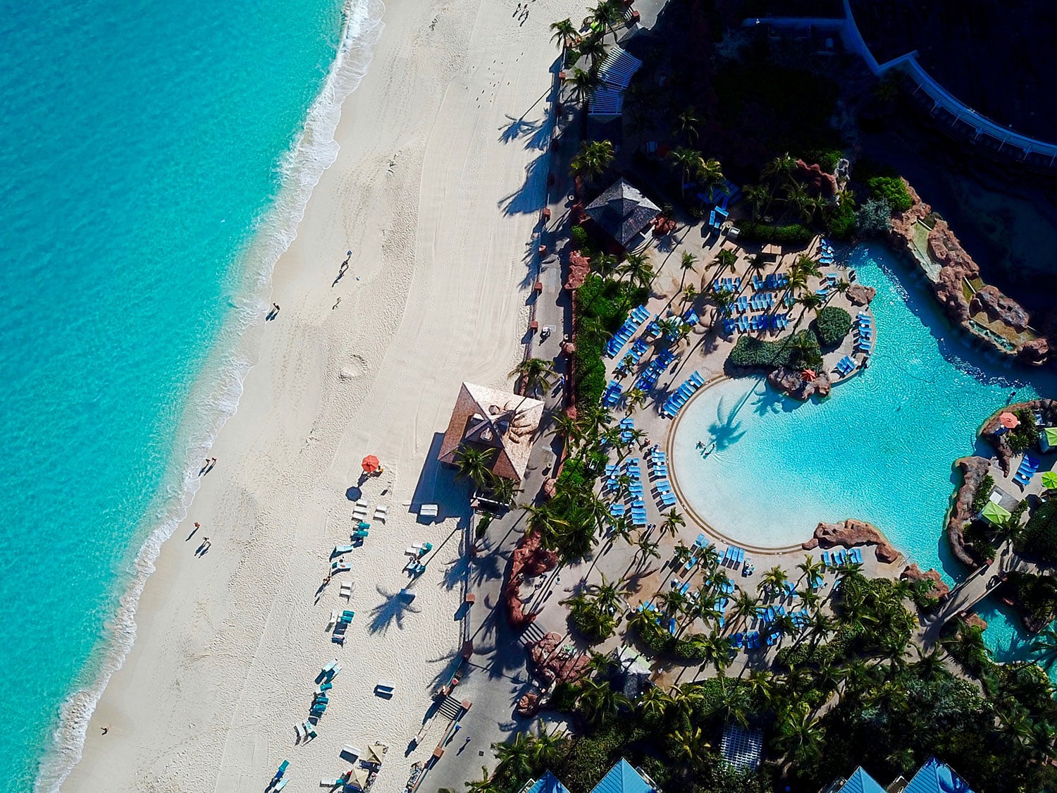 An aerial view of a beach resort on an island.
