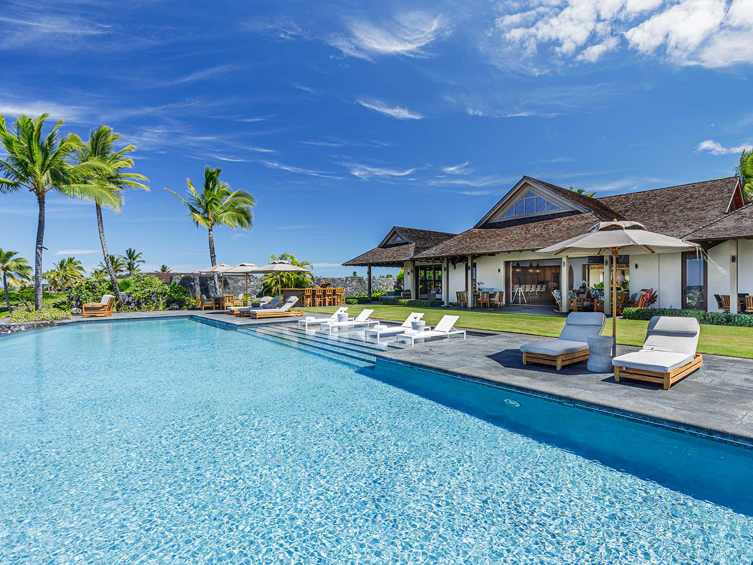 Expansive pool deck at Hawaiian dream house
