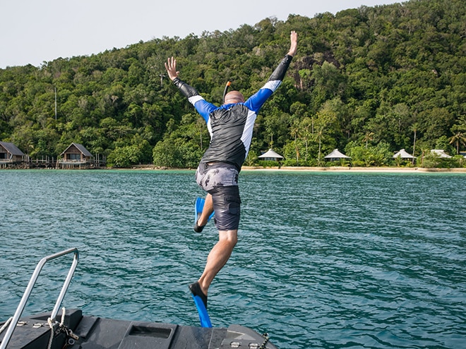 snorkler diving in the water