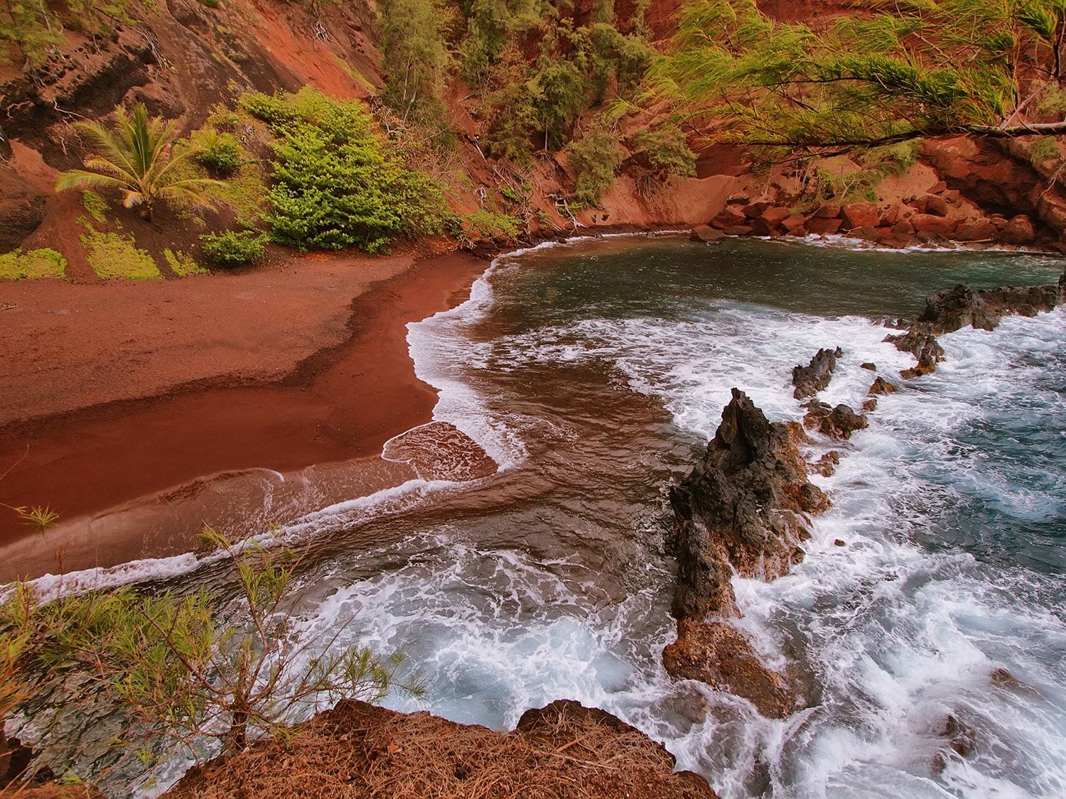 Best beaches in Maui - Koki Beach, a rare red-sand beach