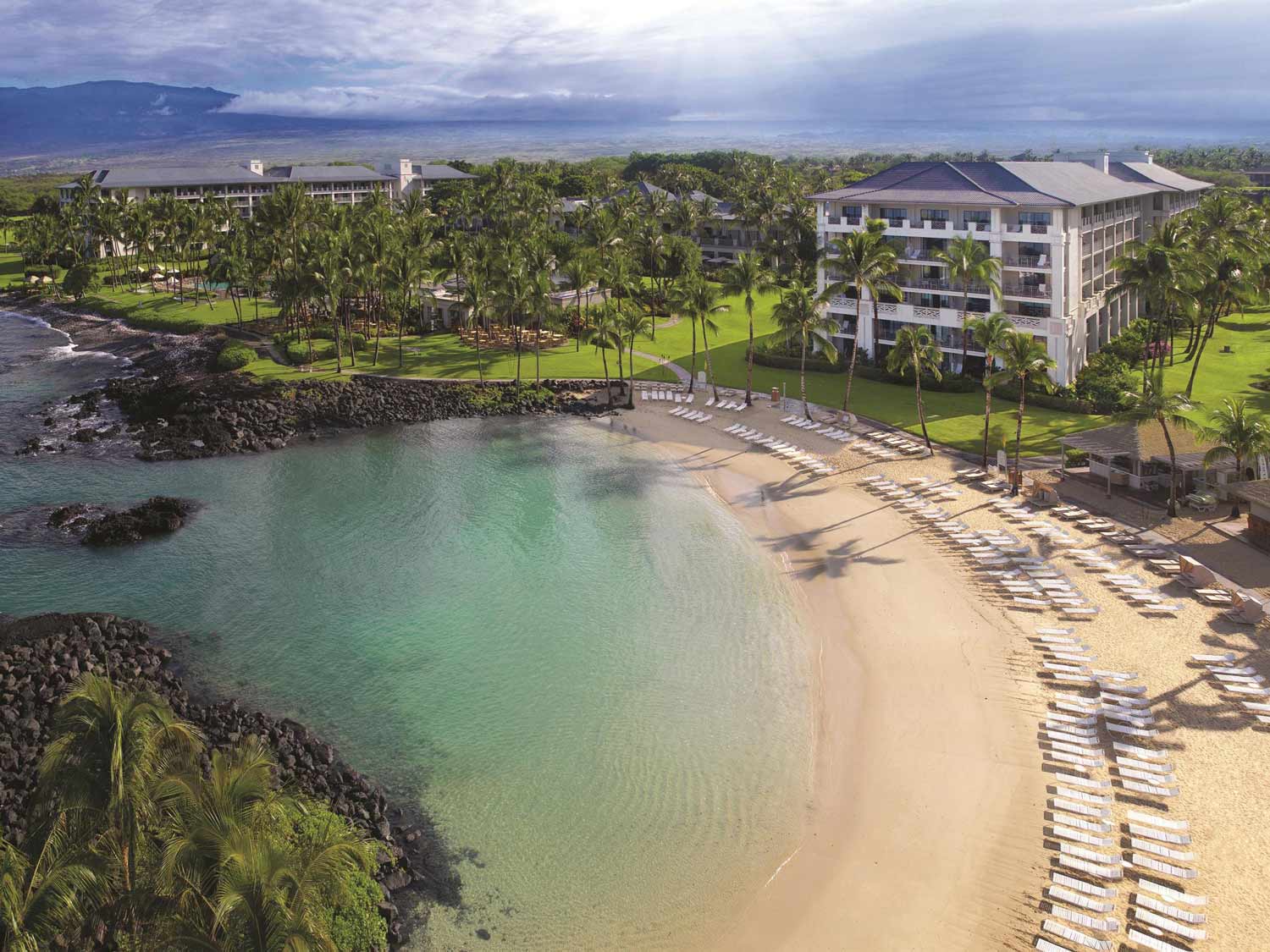 The beach at Fairmont Orchid is studded with black-lava outcroppings