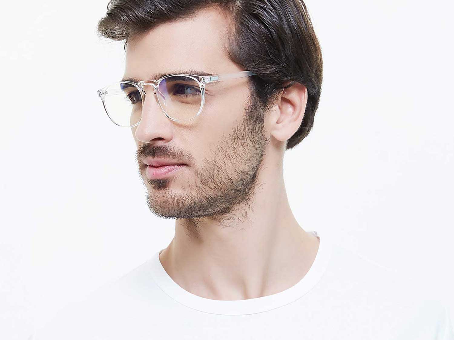Man wearing blue light glasses.