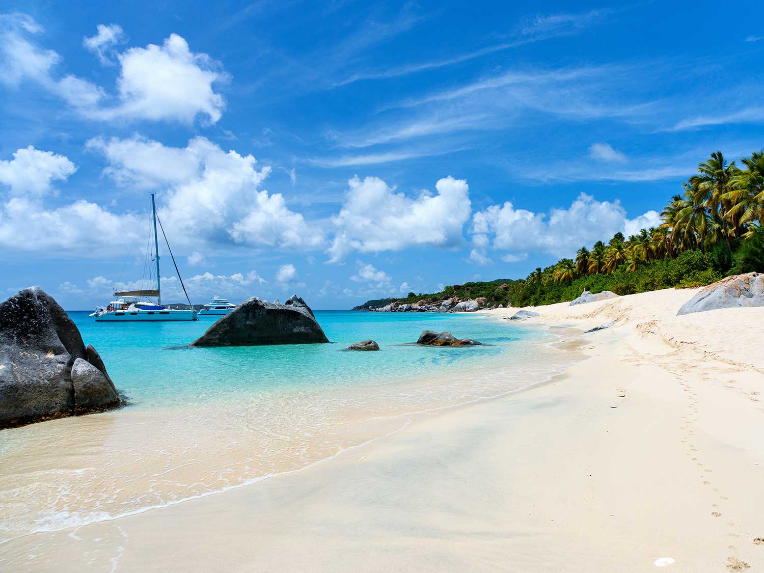 BVI beach with yacht