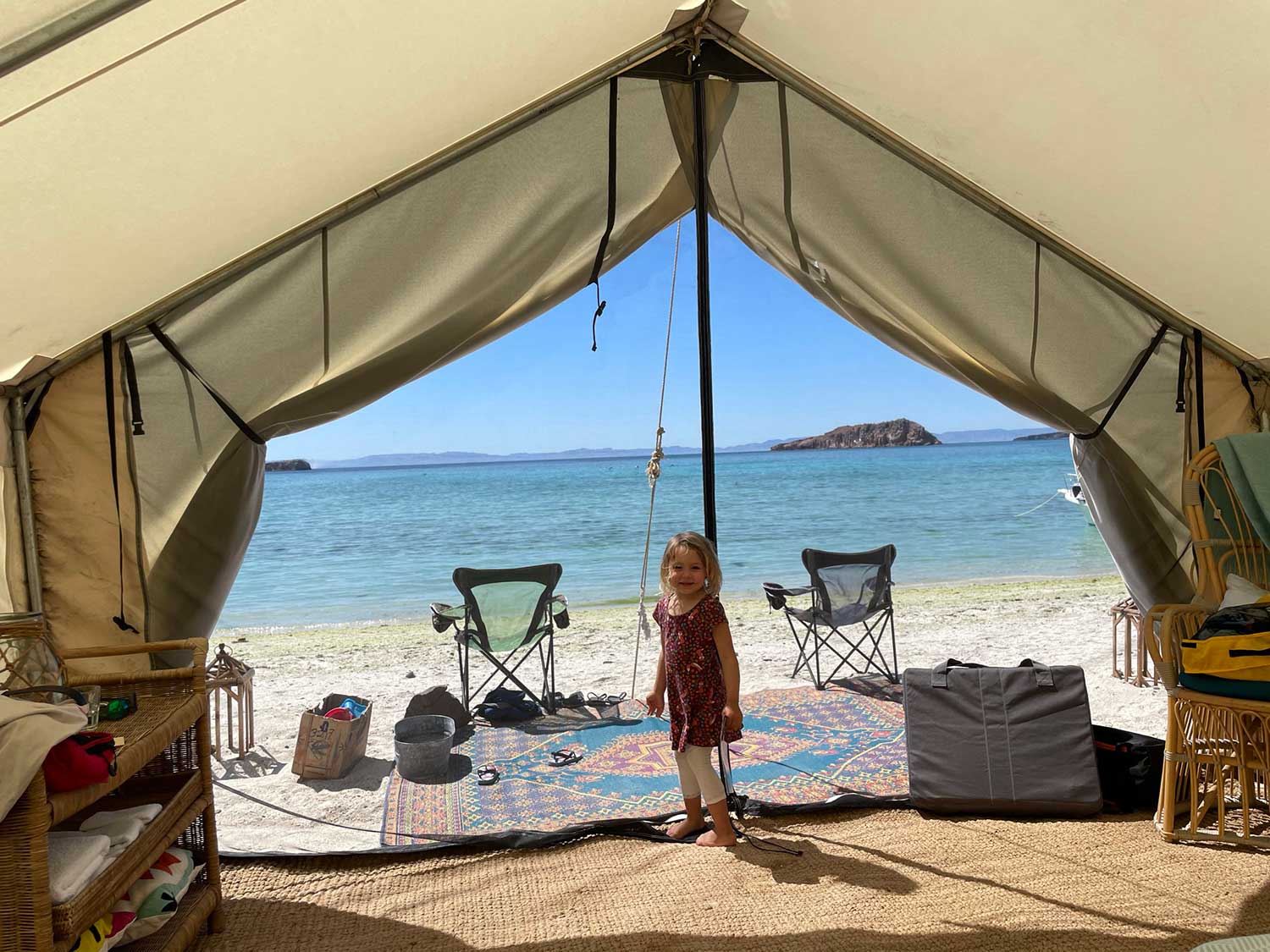 The inside of a camping tent on a beach.