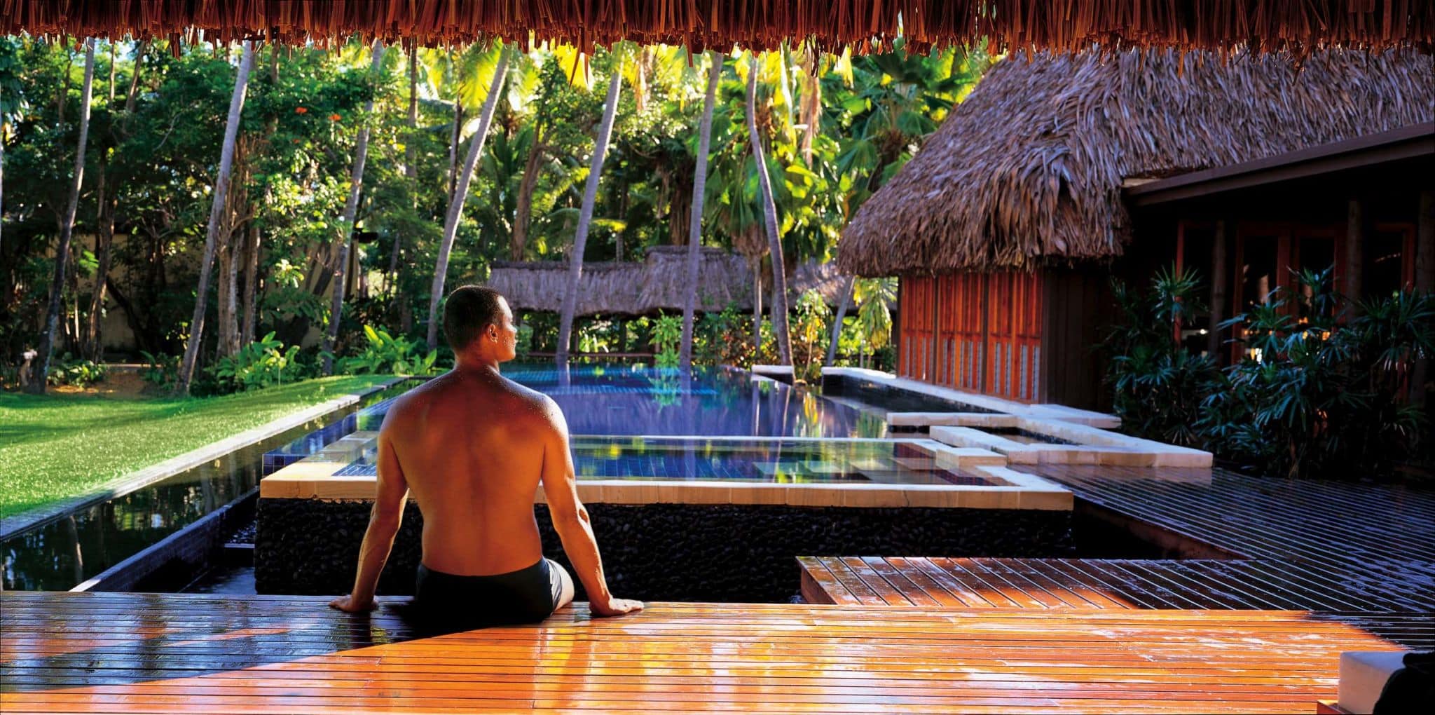 heavenly spa man by pool.jpg