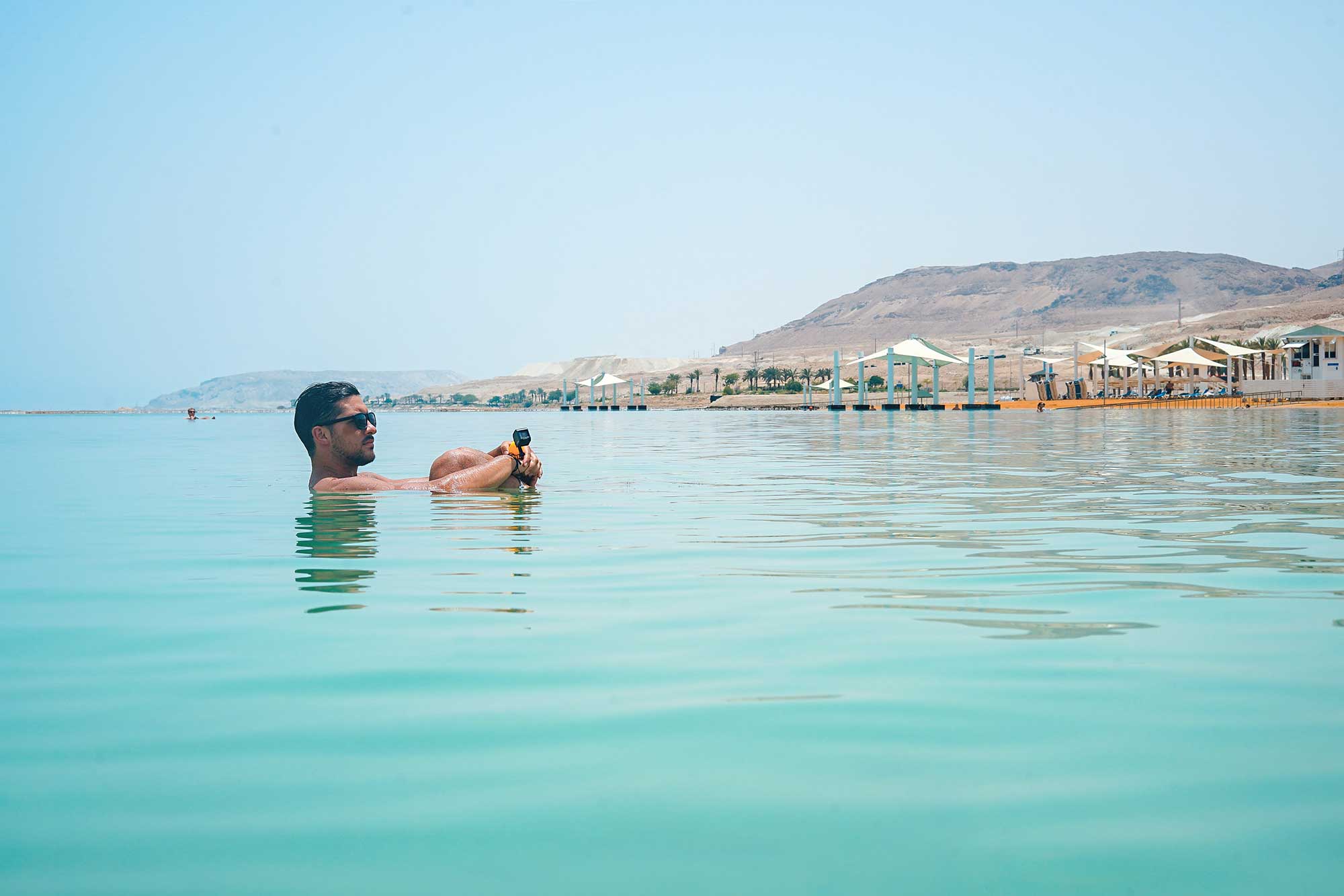 Man sitting in the Dead Sea