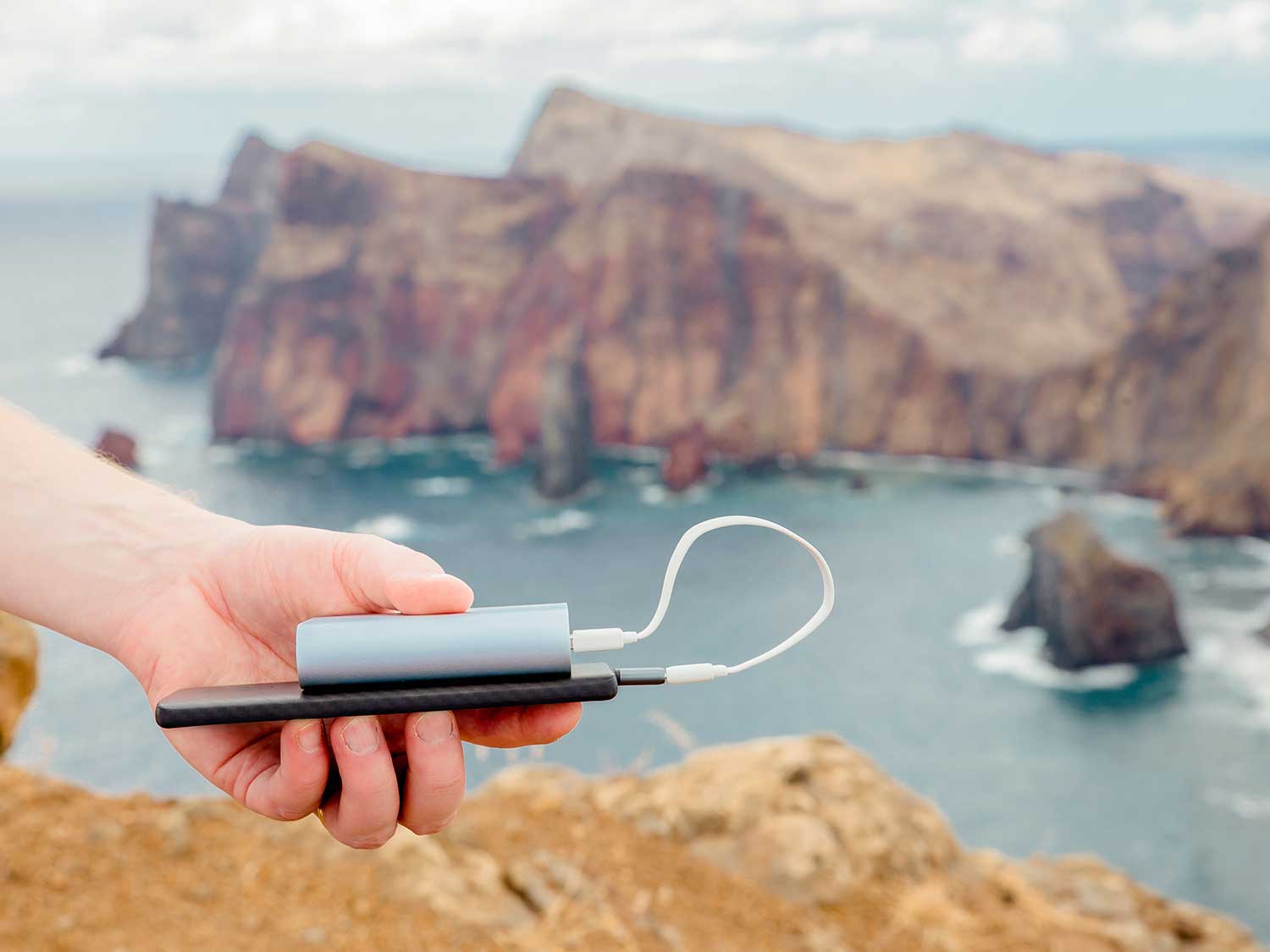 Person holding a power bank