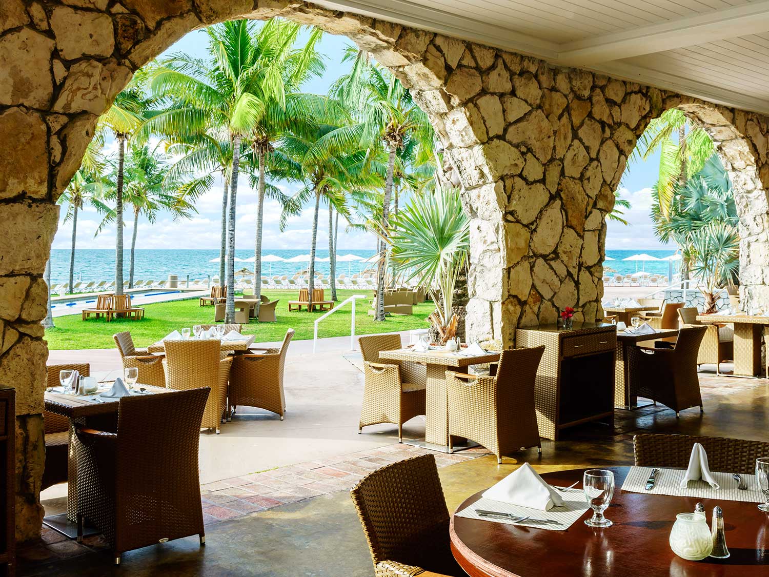 An outside patio and dining area at a resort.