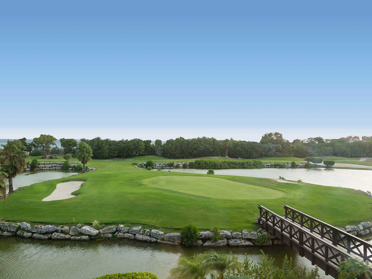 A golf course by the water.