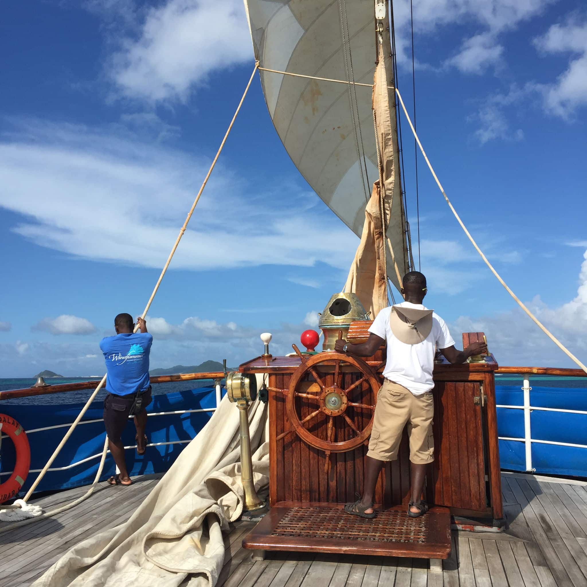Captain Sly at the helm of the s/v Mandalay
