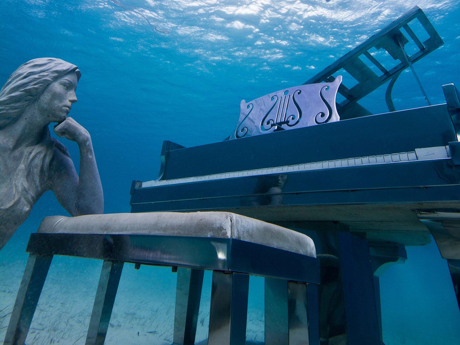 Musha Cay mermaid statue underwater.