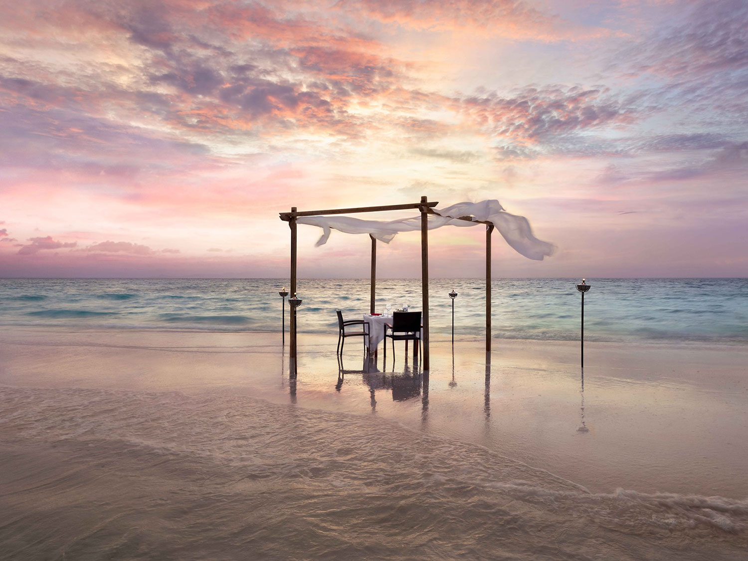 An outdoor dining area on the beach.