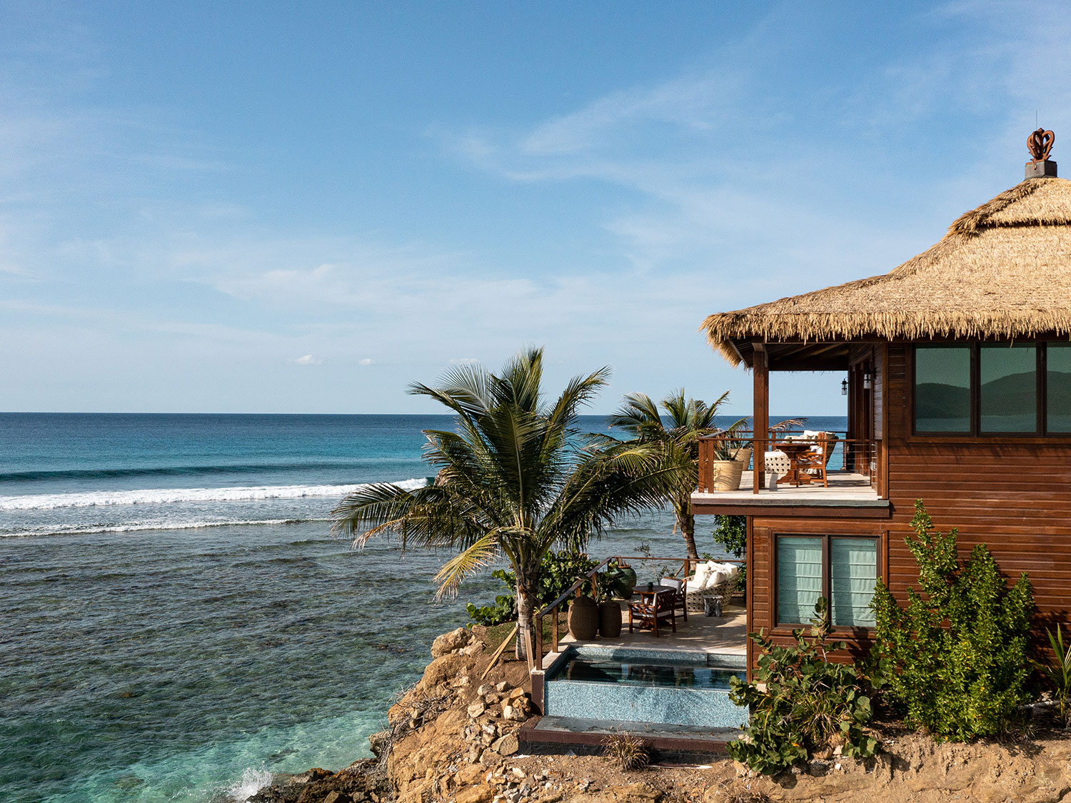 The Bali Hi Resort on Necker Island overlooking a beach.