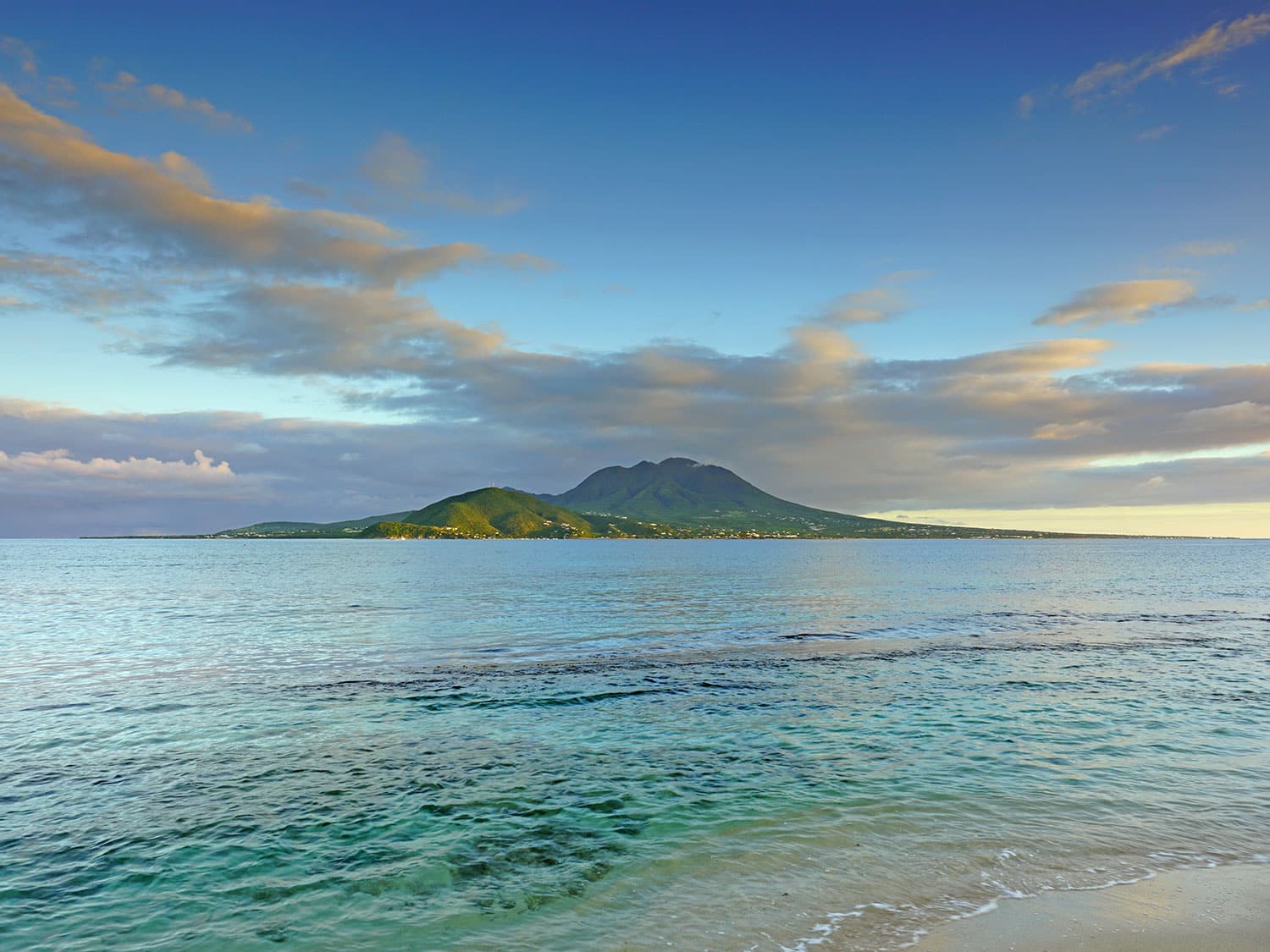 the view of the ocean and lush islands off the beach of Nevis.