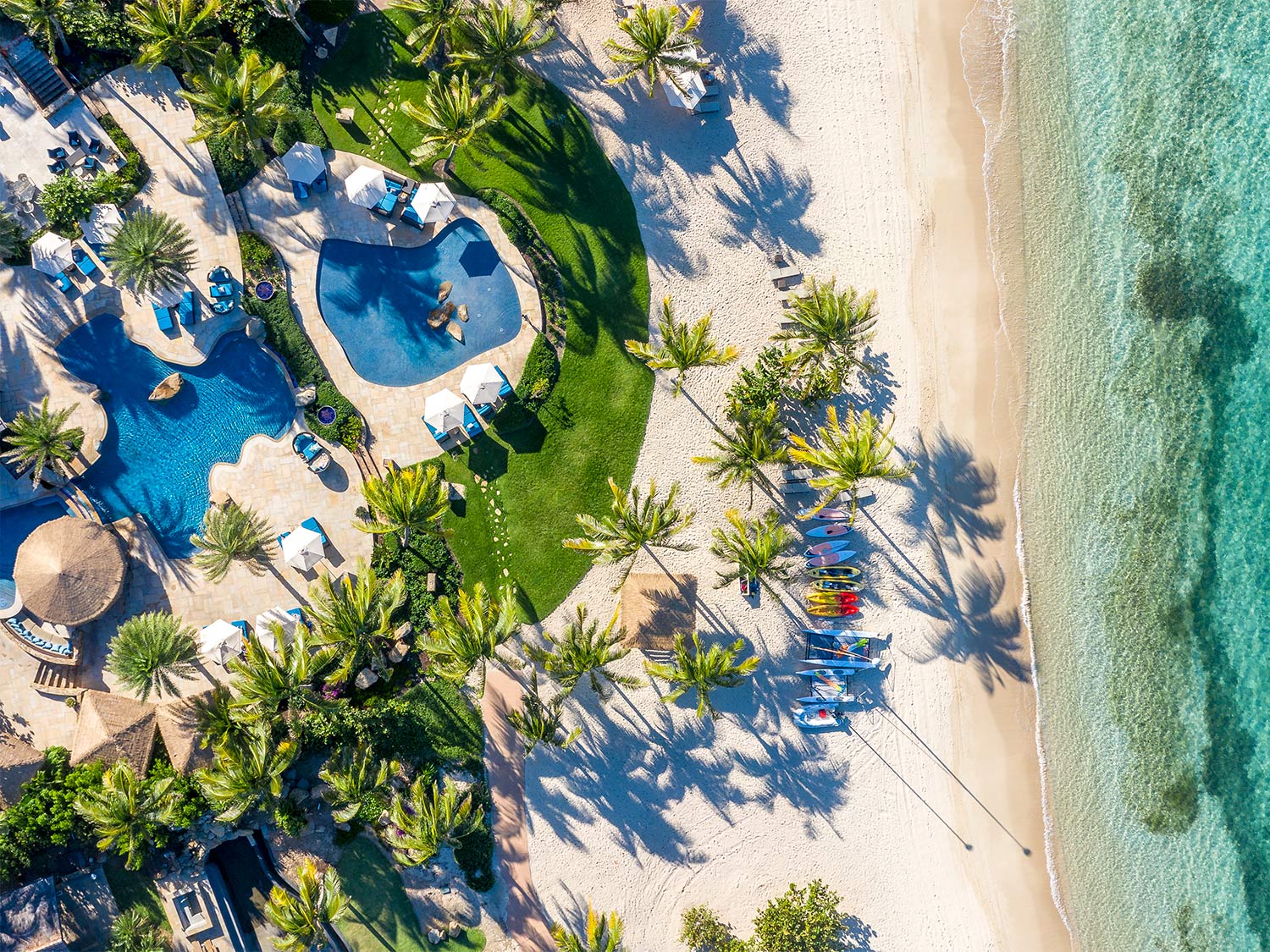 An aerial photo of an Oil Nut Bay island beach resort.