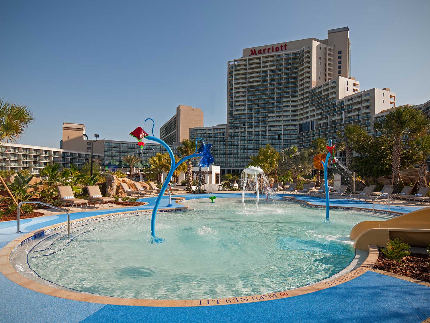 An outdoor kid's pool at a hotel.