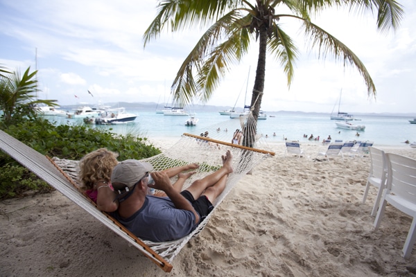Couple lying on a hammock on the beach