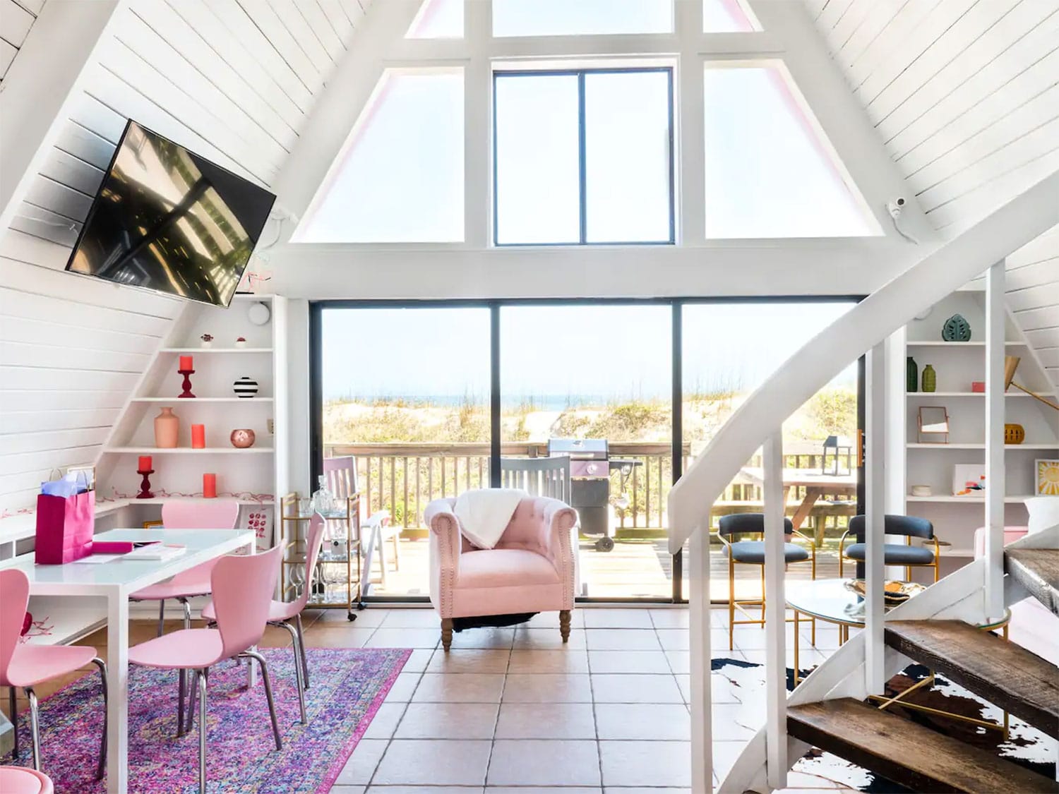An Airbnb home with pink furnishings.