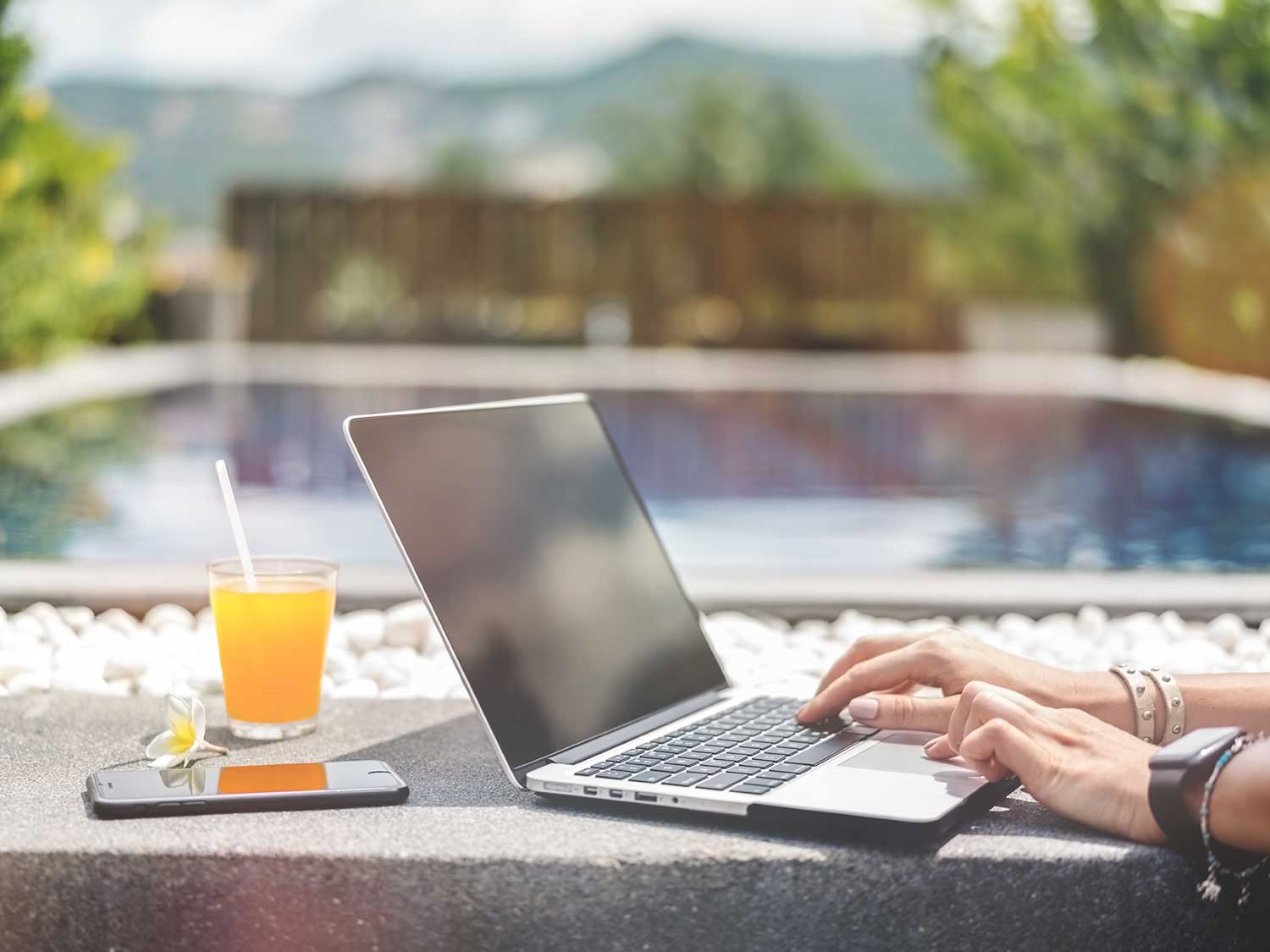 laptop by the pool