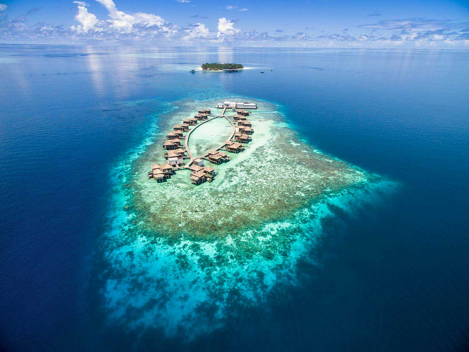 Aerial view of the villas at Raffles Maldives Meradhoo