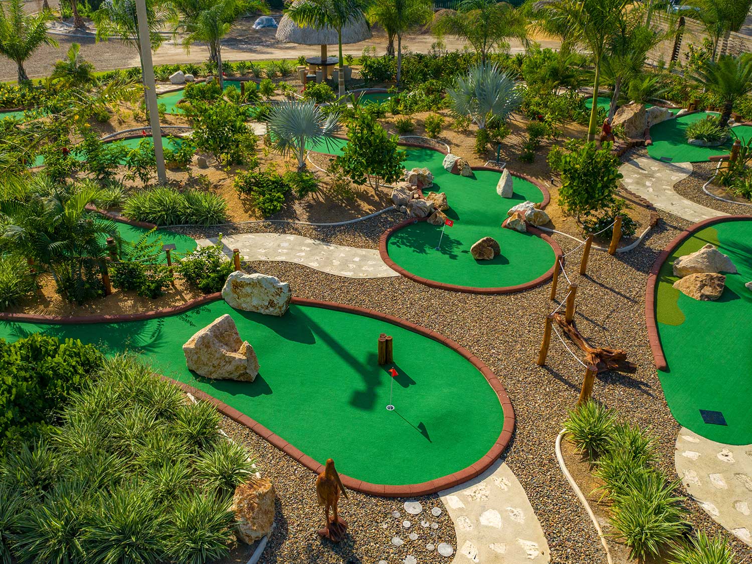 A minigolf area at a beach resort.