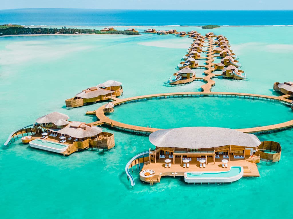 A pier of overwater bungalows at Soneva Jani.