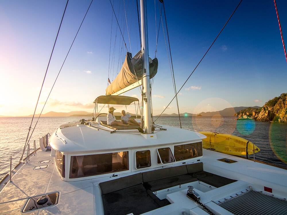 couple enjoys sunset aboard charter from Festiva Sailing Vacations