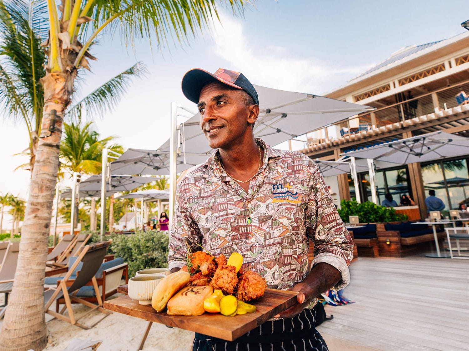 Celebrity Chef Marcus Samuelsson showcasing the signature fried chicken from his restaurant, Marcus at Baha Mar Fish + Chop House.