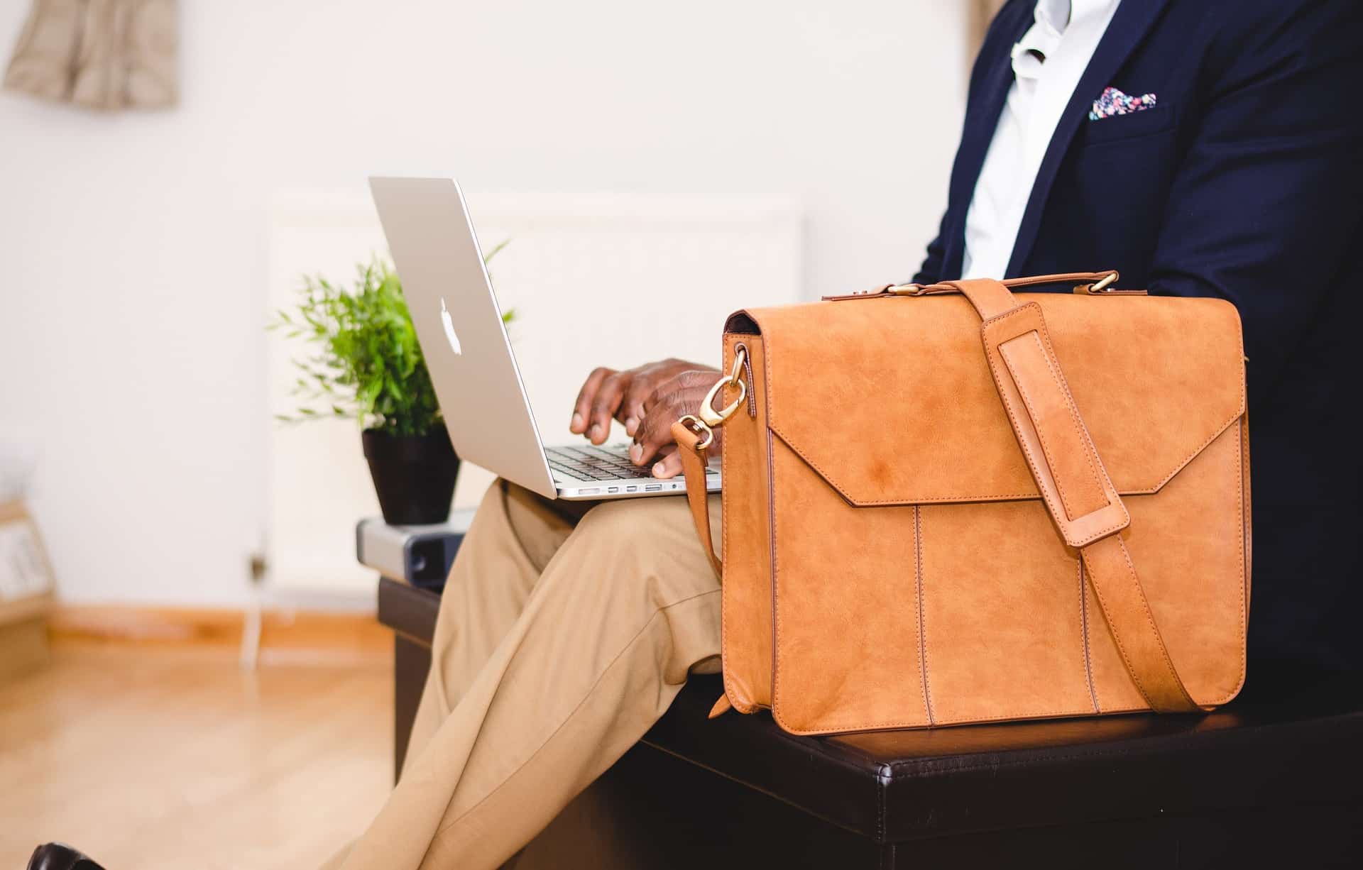 Businessman with laptop and travel bag