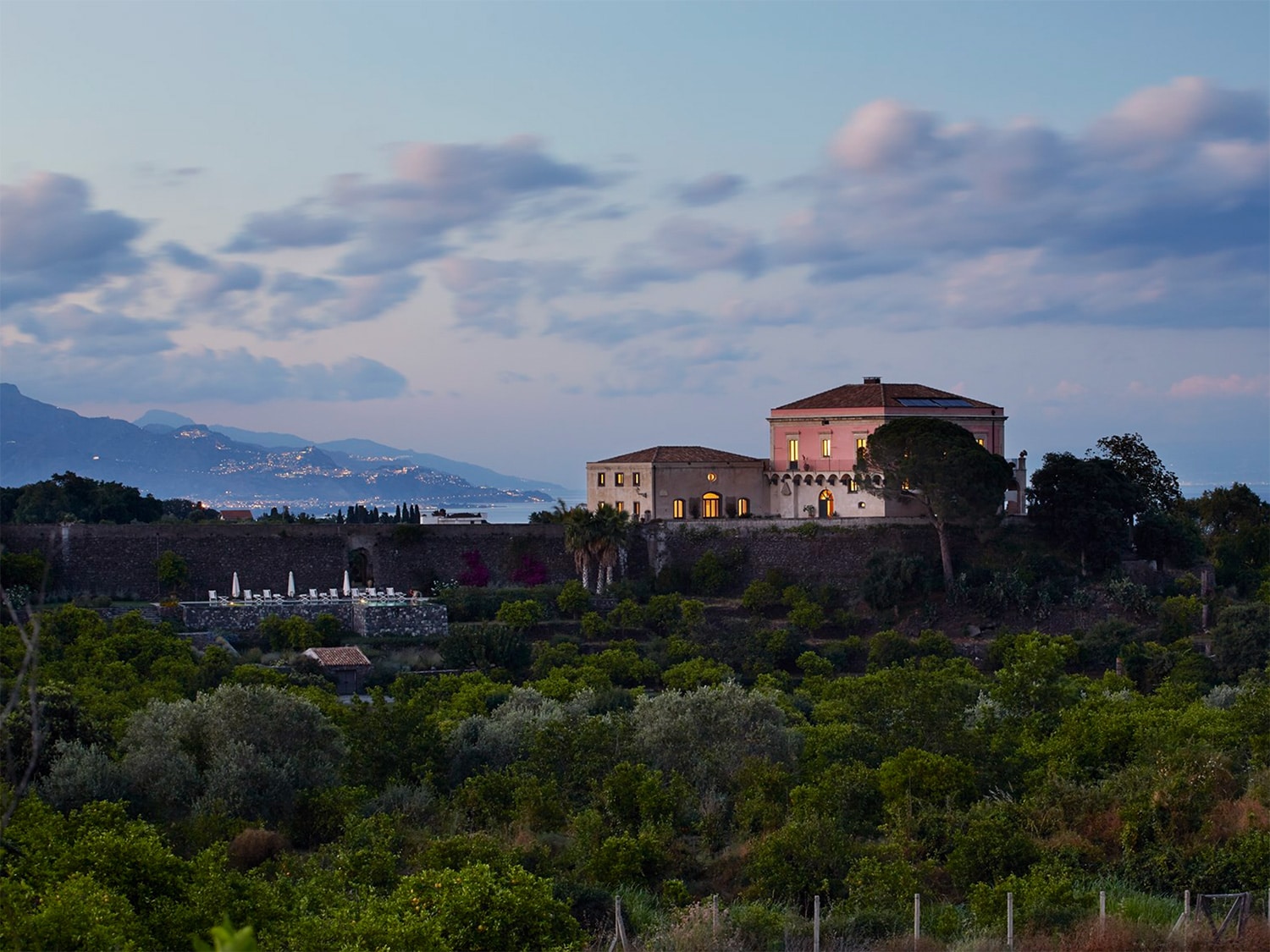 An aerial view of Rocca delle Tre Contrade, a luxurious 12-bedroom villa located in Taormina, Sicily, Italy.