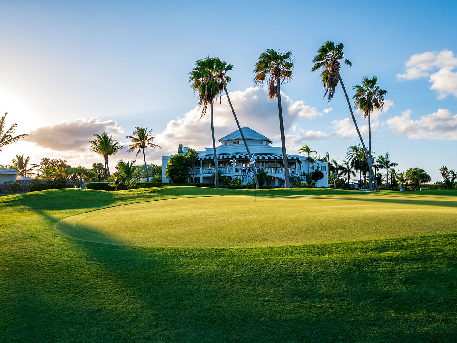 A view of the clubhouse at Royal Turks and Caicos Golf Club from the green on Hole 18.