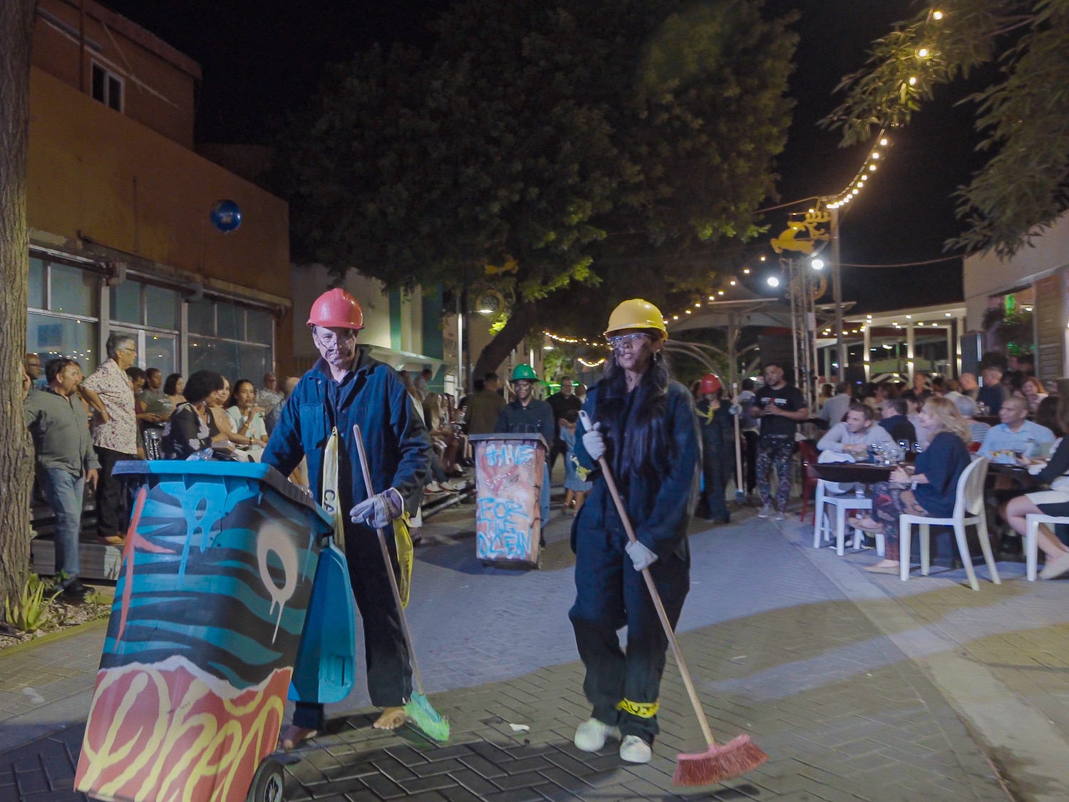 A performance art demonstration in downtown San Nicolas, Aruba, during the 2022 Aruba Art Festival and Fusion Pop-up Restaurant.