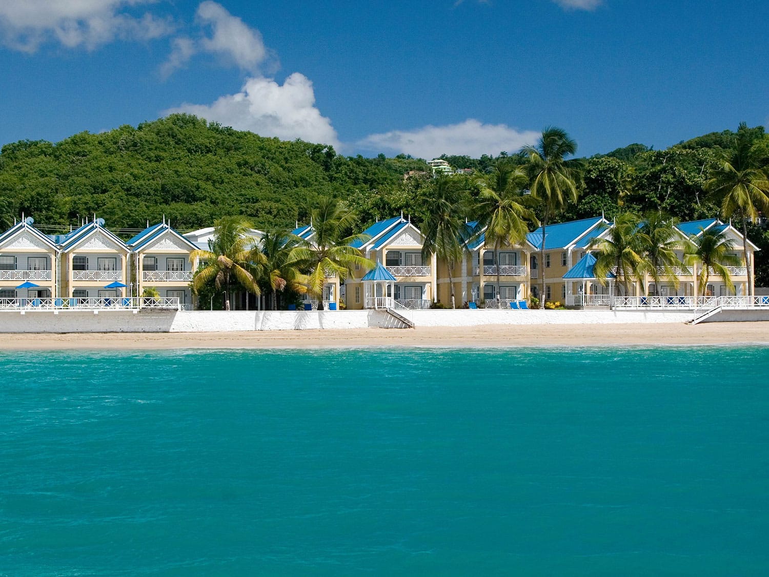 The daytime view of the beach and property at Villa Beach Cottages in St. Lucia.