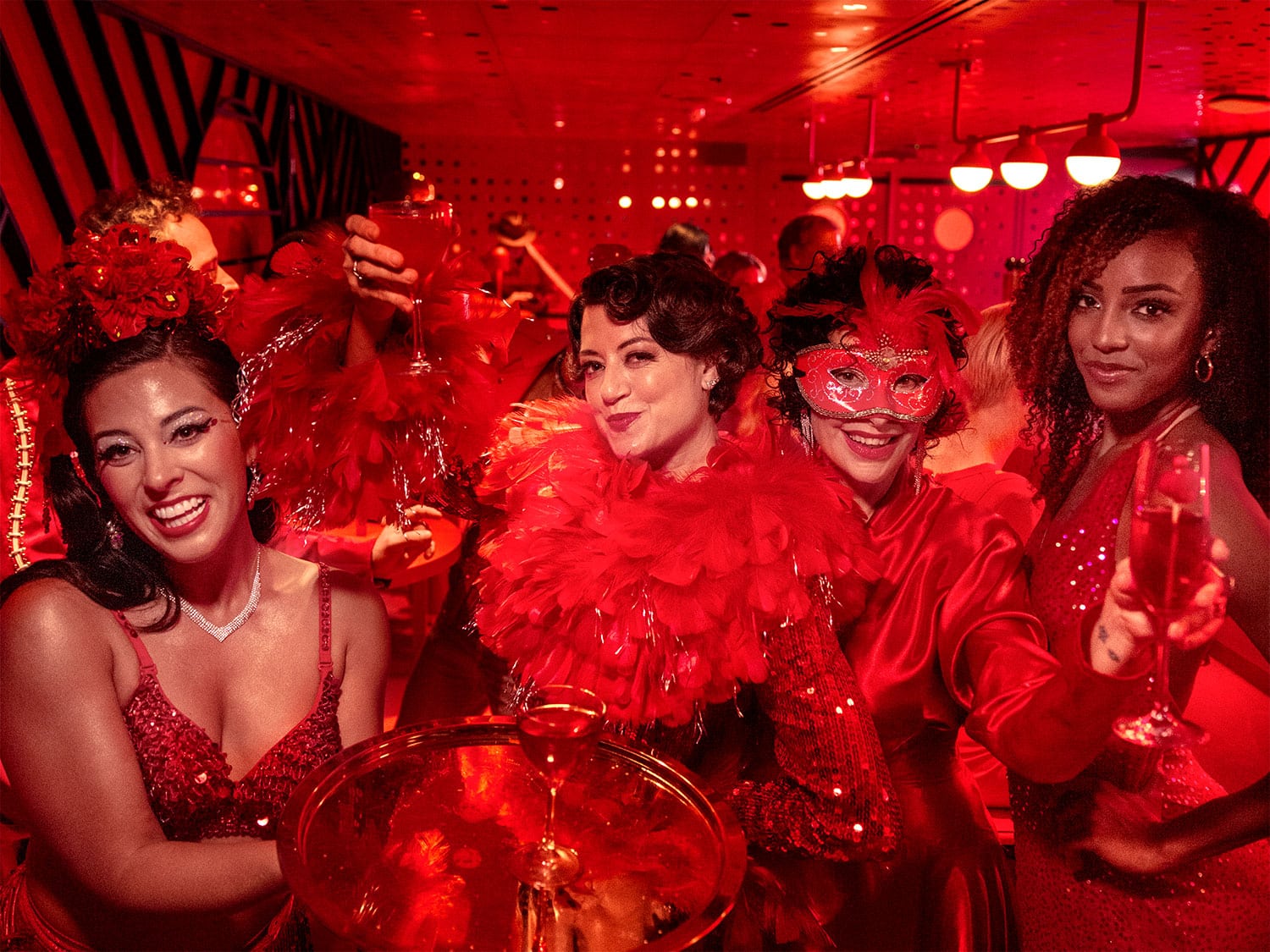 A group of performers from Scarlet Night on the Virgin Voyages Valiant Lady.