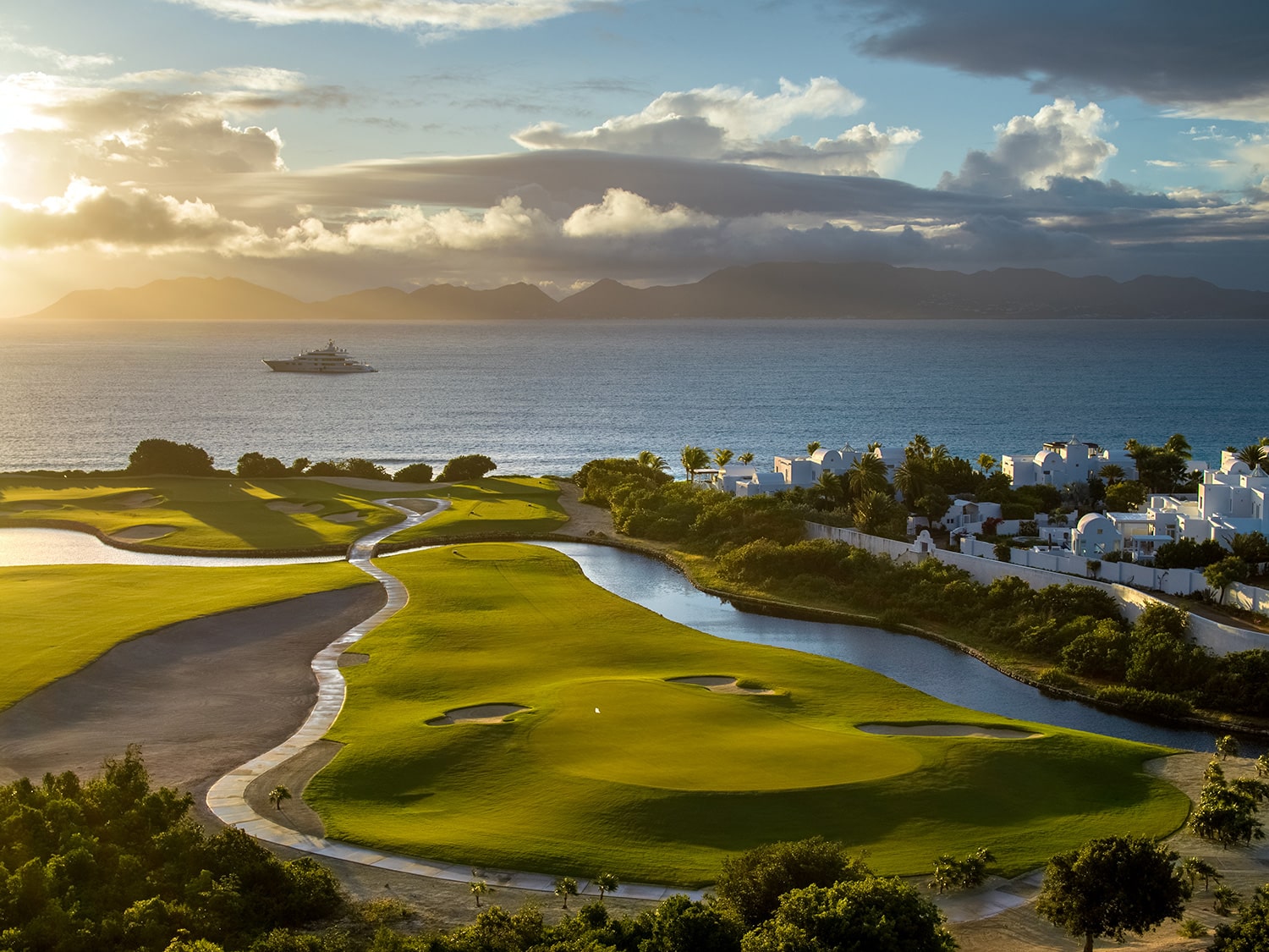 A drone's eye view of Hole 11 at Aurora Anguilla Golf Resort and Spa, set against Rendezvous Bay.