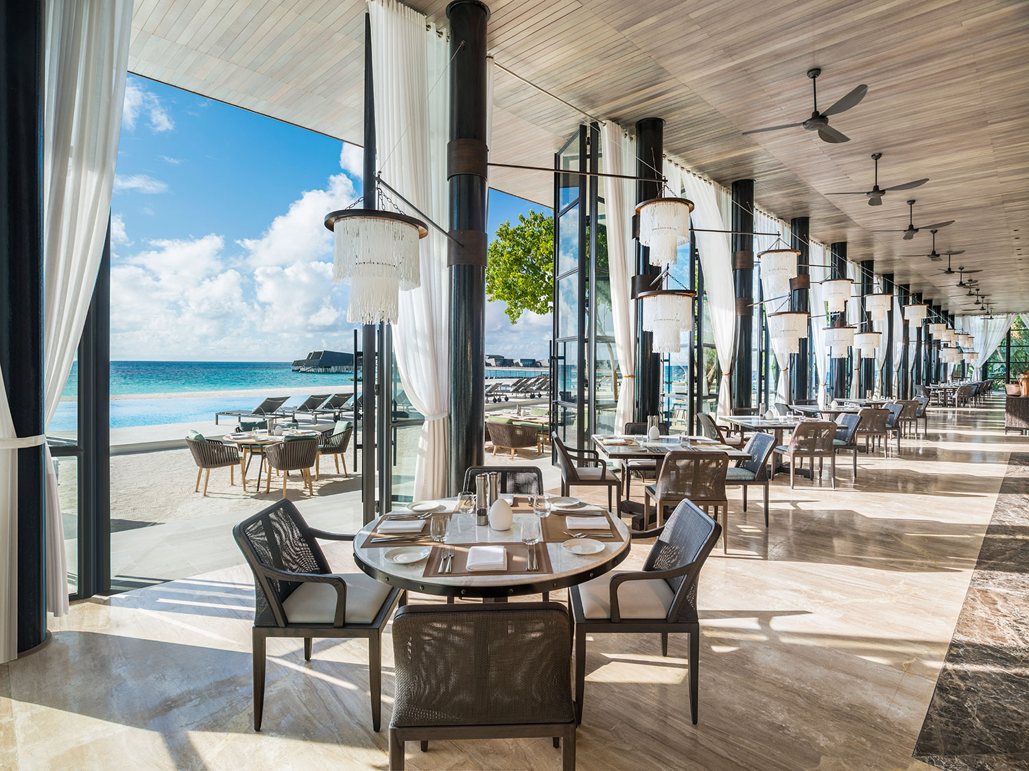 The interior of the Alba restaurant at The St. Regis Maldives Vommuli Resort.