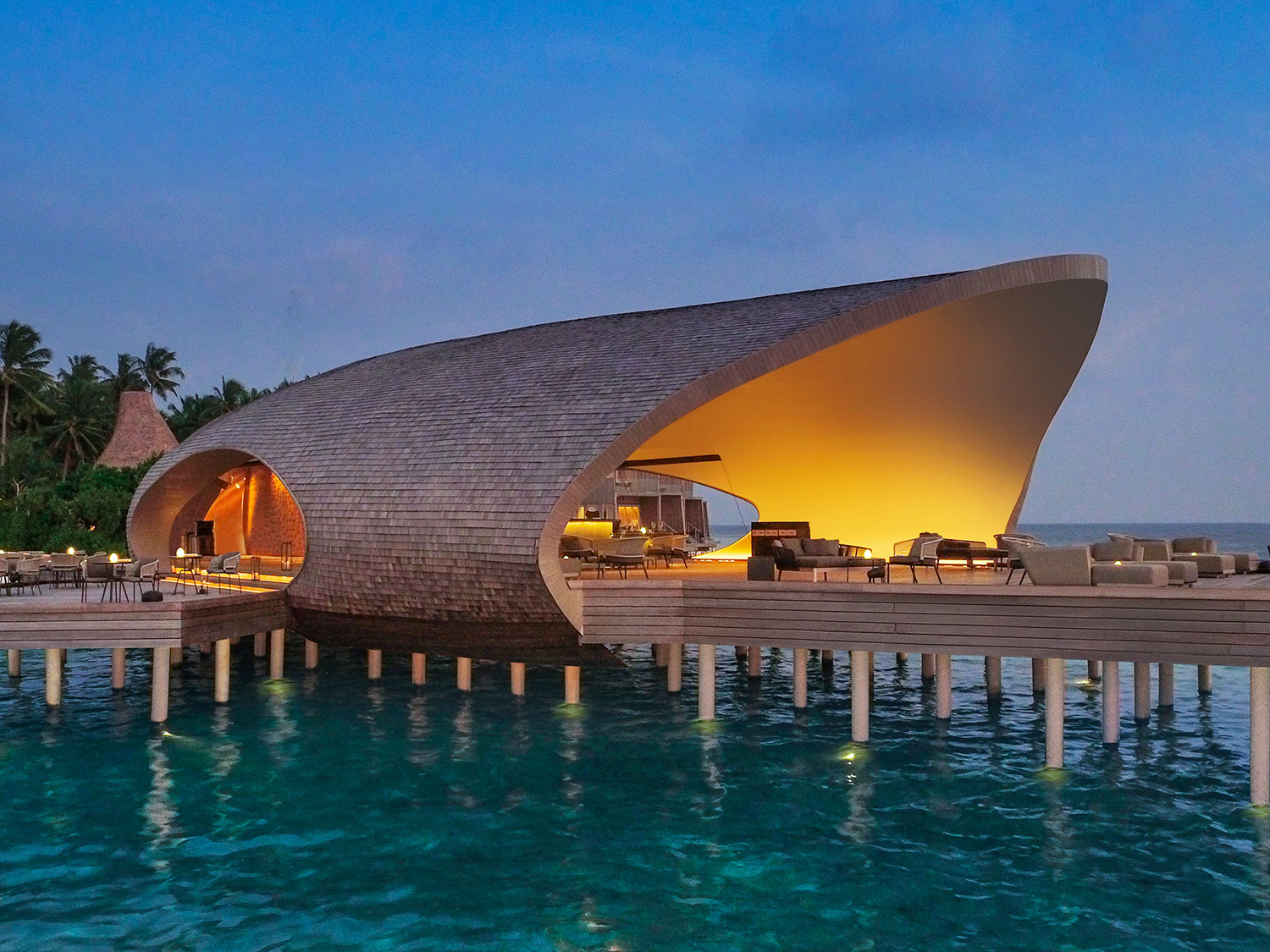 The St. Regis Maldives Vommuli Resort Whale Bar at night.