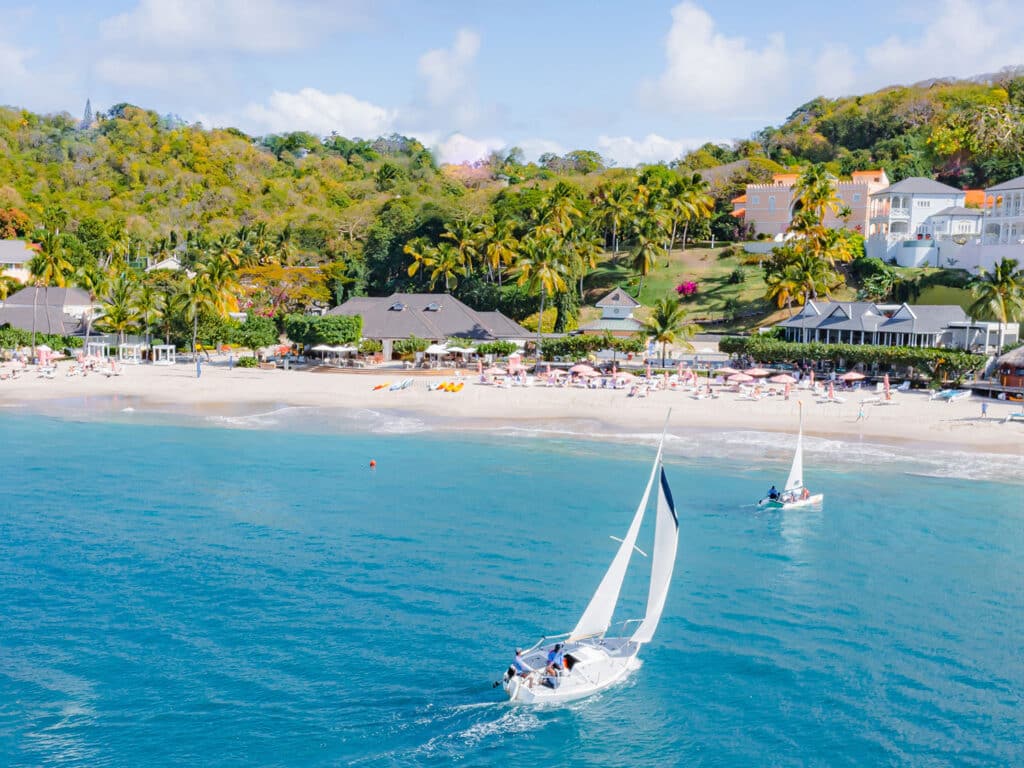 An exterior view of the BodyHoliday resort in St. Lucia and the adjacent beach with watersports.