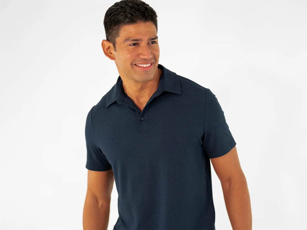 A man wearing a Bearbottom Clothing Tech Polo.