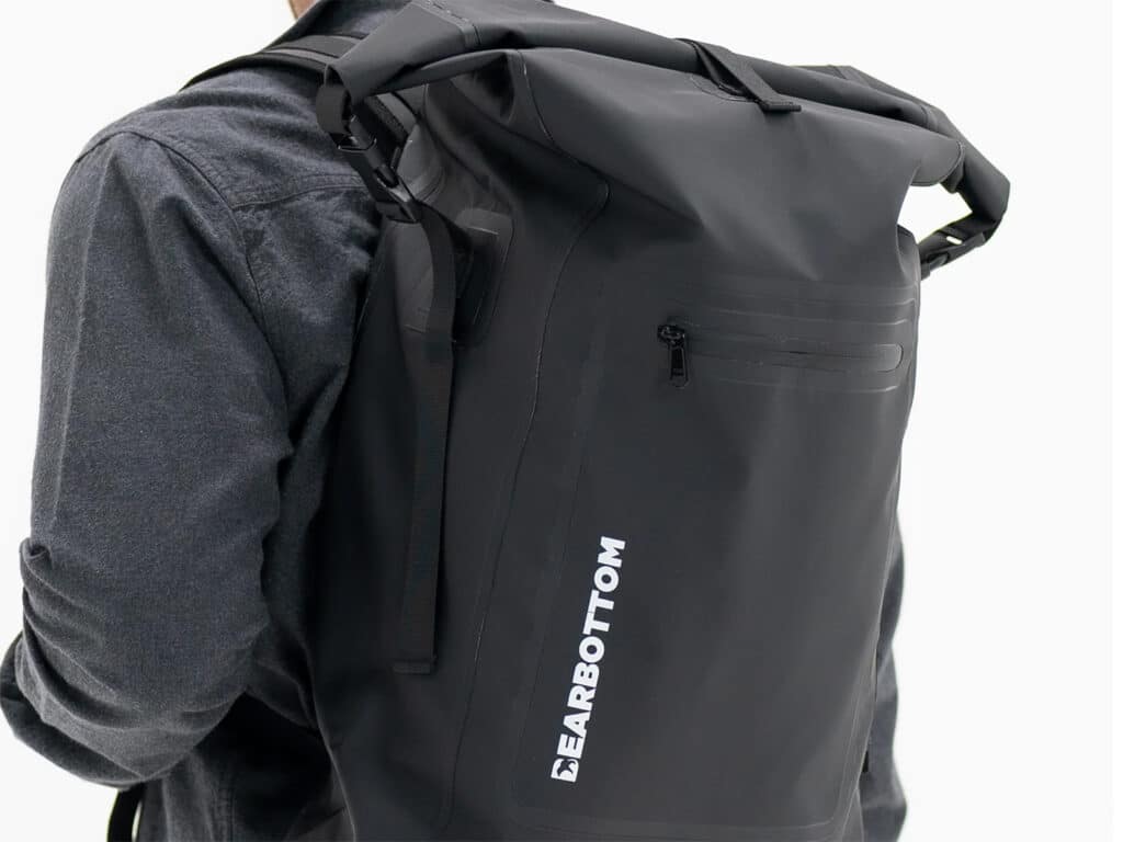 A man wearing the Bearbottom Rapids Dry Backpack 30L.