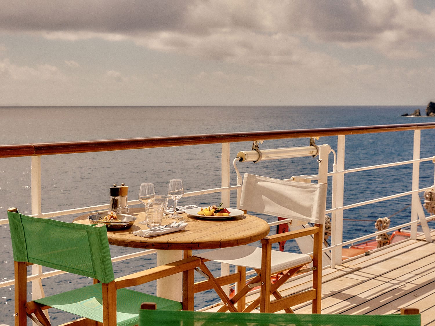 The deck dining experience and view from the Club Med 2 luxury sailing yacht.