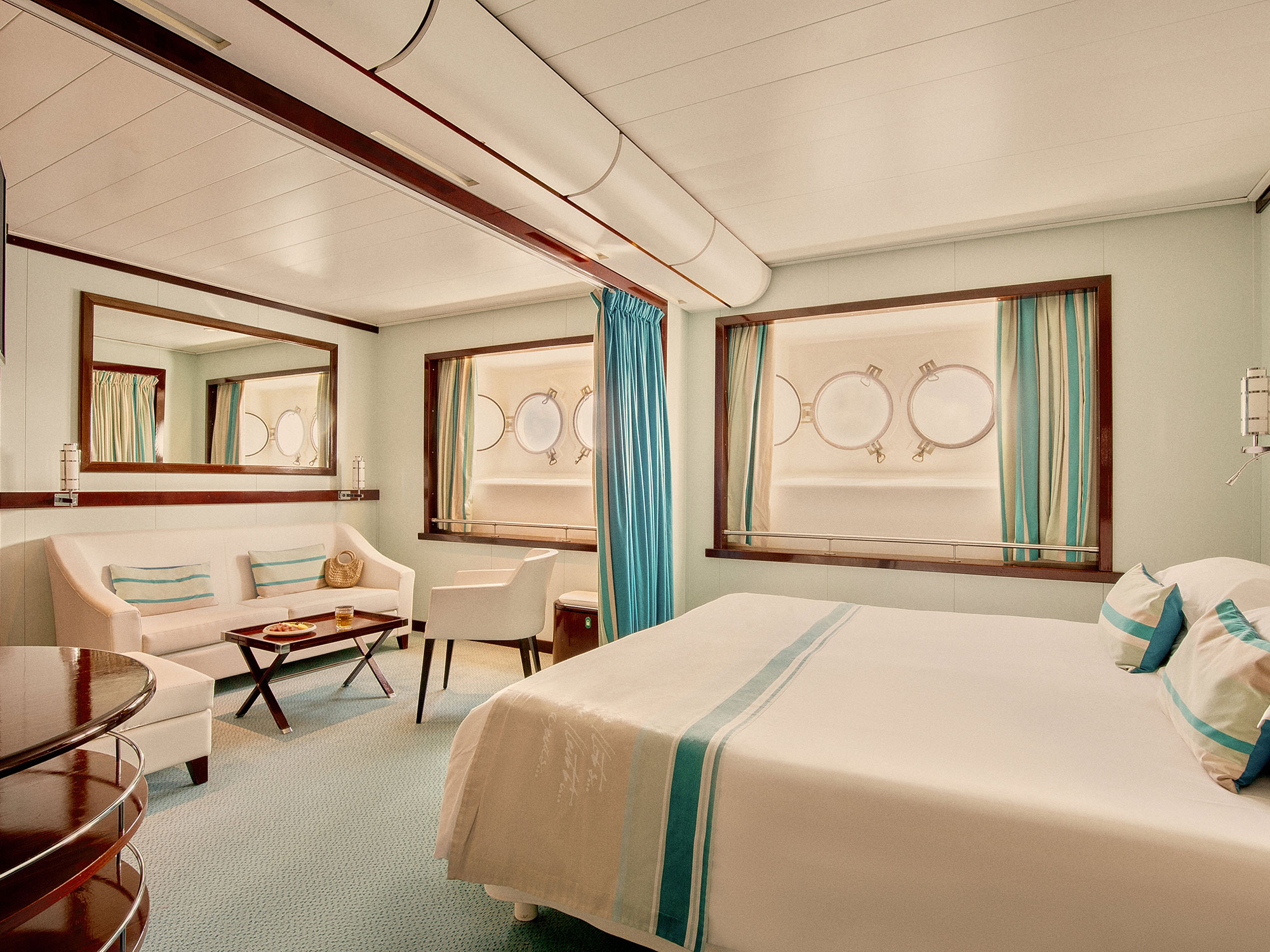 An interior view of a bedroom on the Club Med 2 luxury sailing yacht.