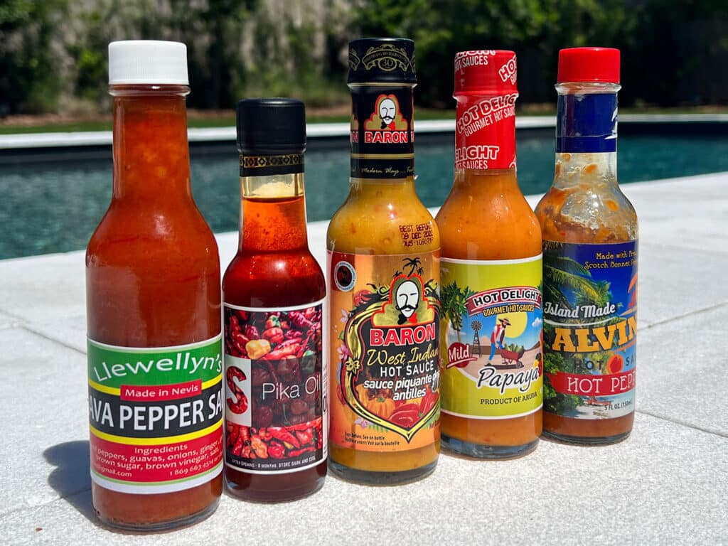 5 Caribbean Hot Sauces that Need to Be on Your Food Islands