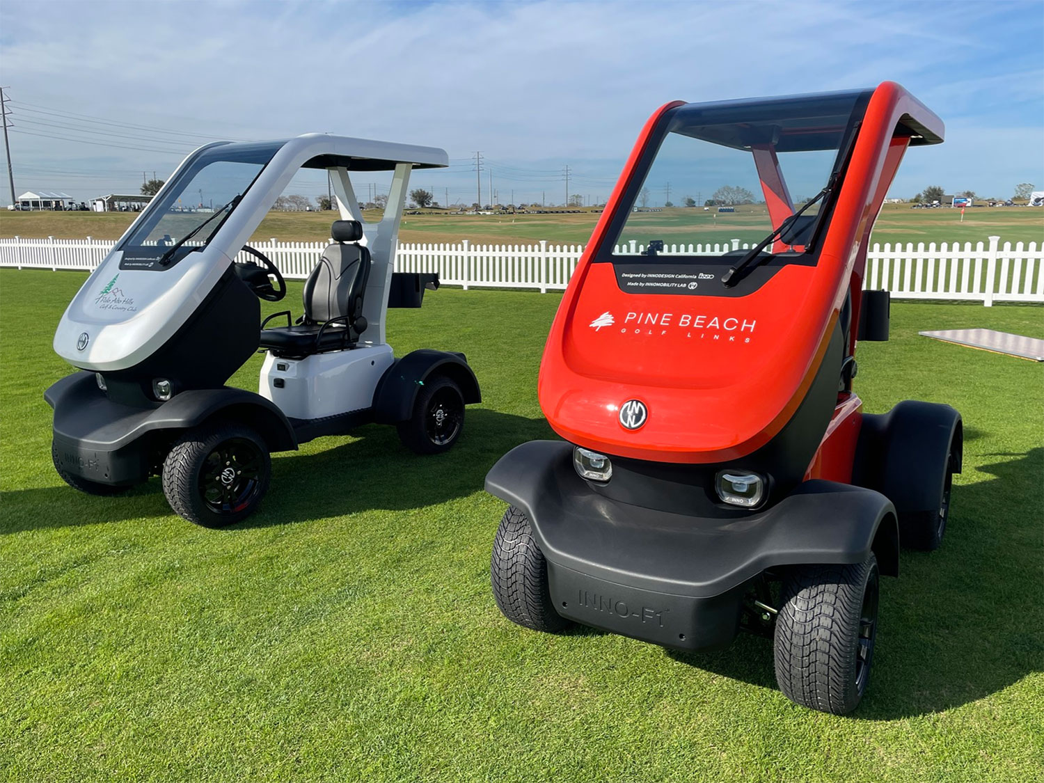 A pair of INNO F-1 Golf Cars on display at the 2023 PGA Show in Orlando.