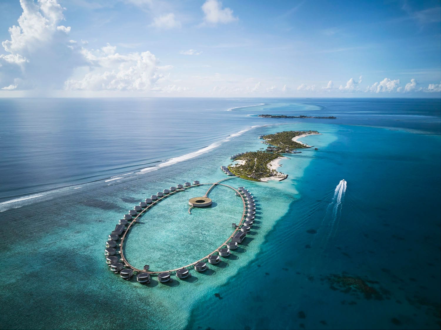 An aerial view of the property and bungalows at The Ritz-Carlton Maldives, Fari Islands.
