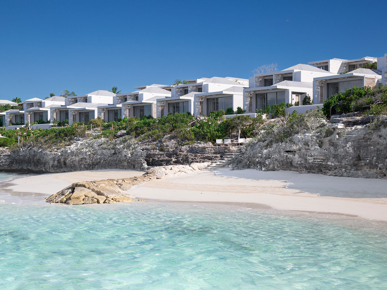 An exterior view of the beachside accommodations of Rock House Turks and Caicos Resort on the island of Providenciales.