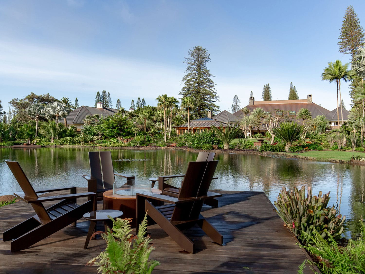 An outdoor, waterside seating area at Sensei Lanai, A Four Seasons Resort, in Hawaii.