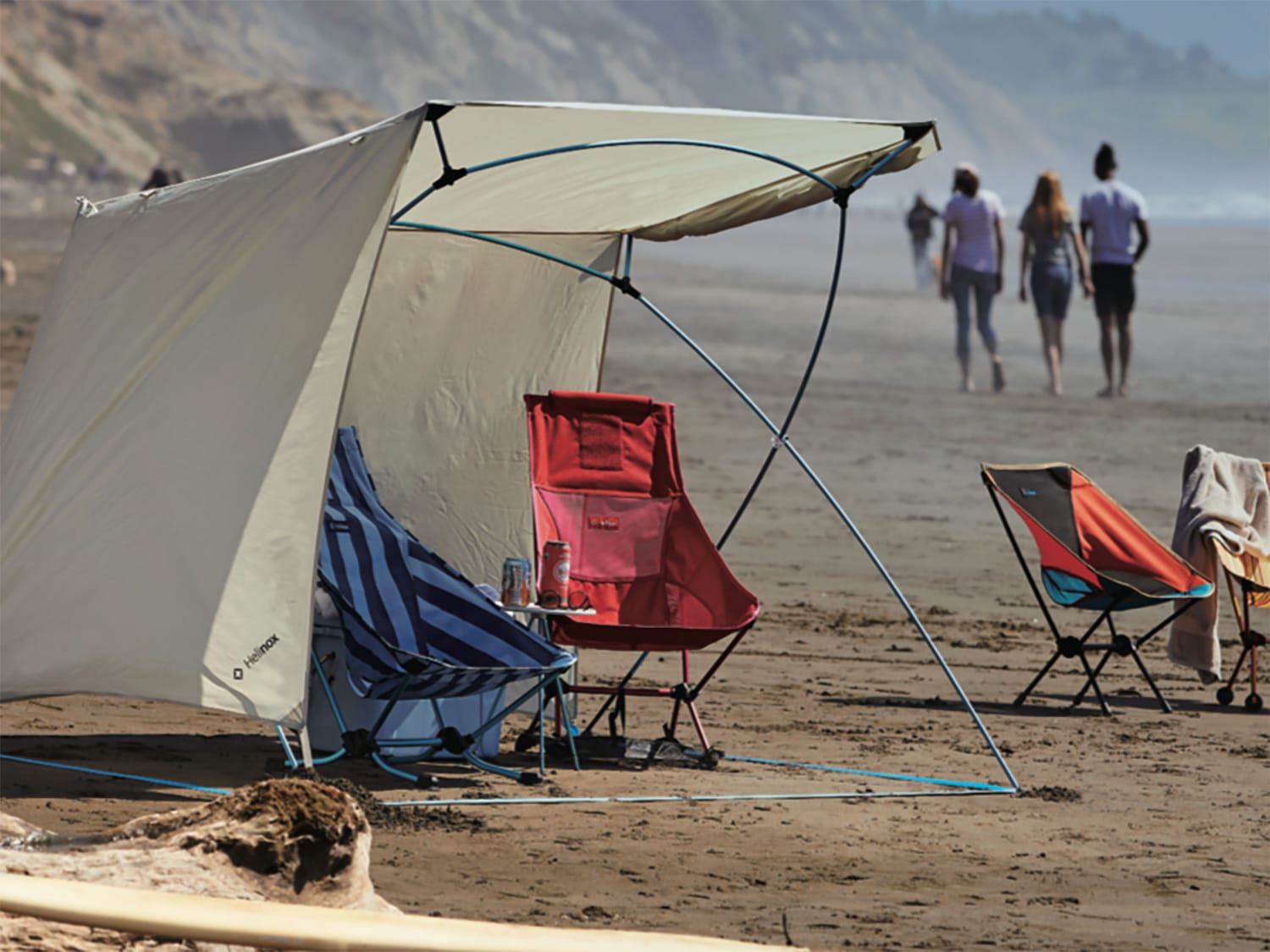 The Helinox Royal Box shade tent set up on a beach.